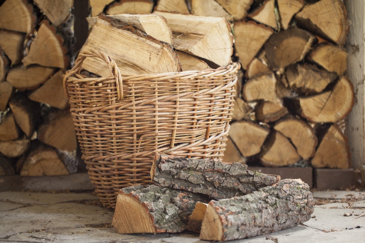Basket and stacked firewood logs.